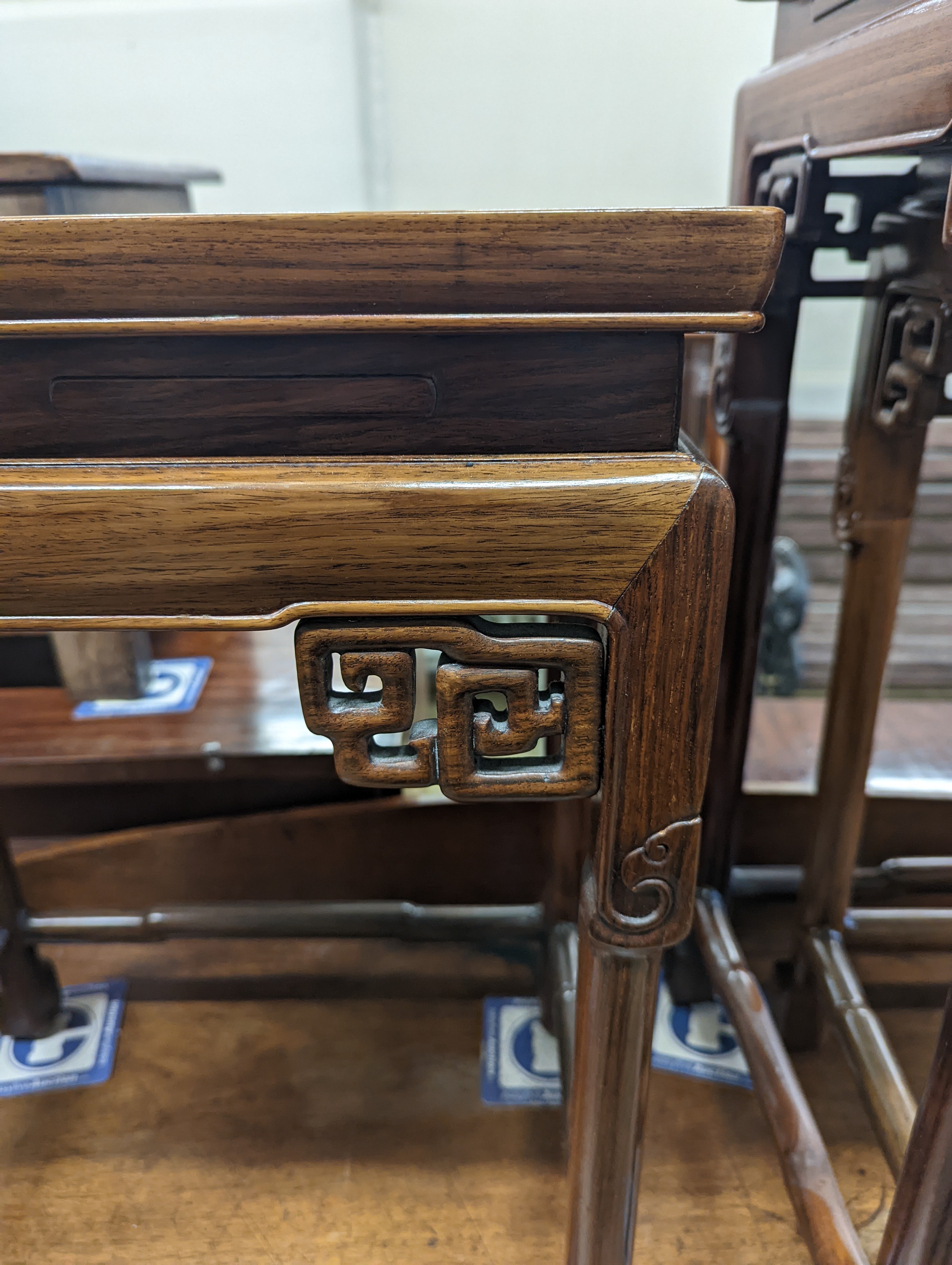 A nest of three Chinese rectangular tea tables, width 61cm, depth 36cm, height 66cm